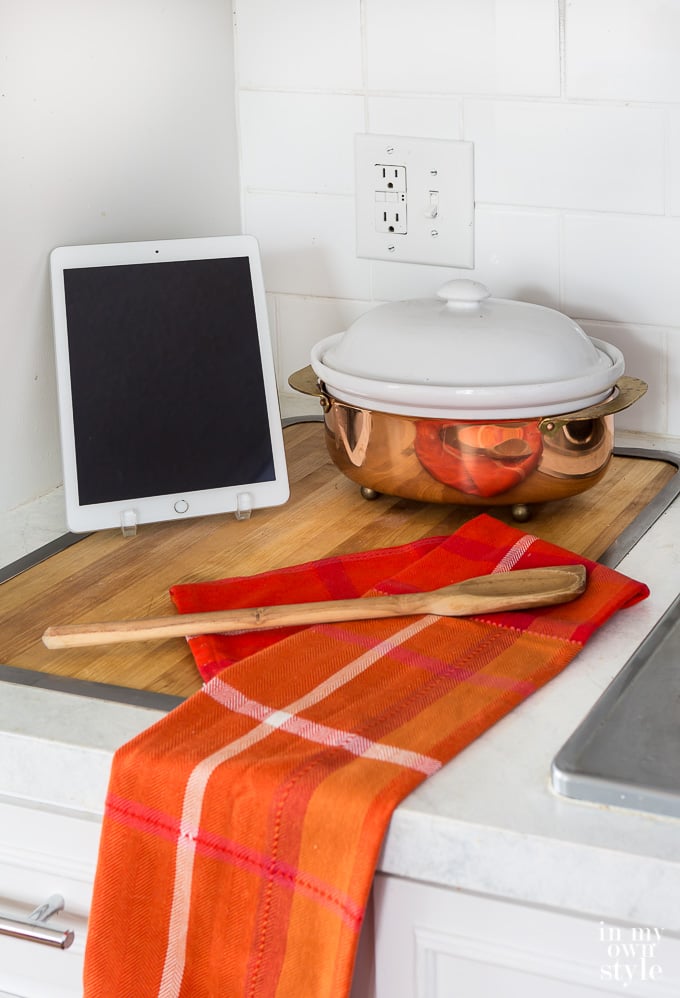 I pad and copper soup pot on kitchen counter