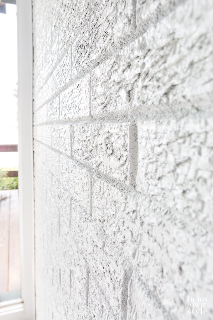 Close up of a white painted brick wall