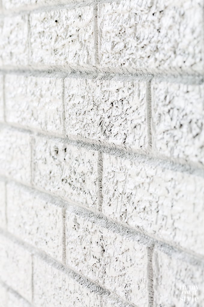 close up of white painted brick wall