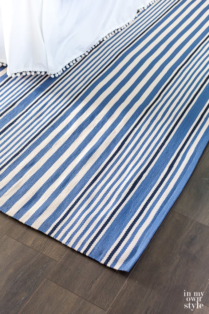 Blue and white striped area rug