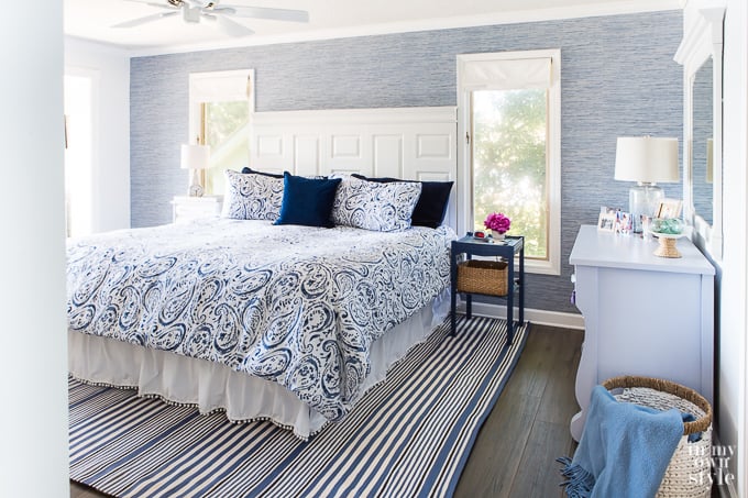 Blue grasscloth on accent wall in master bedroom