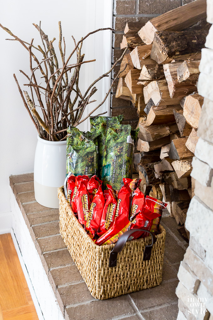 Wood and firelogs stacked on a fireplace hearth