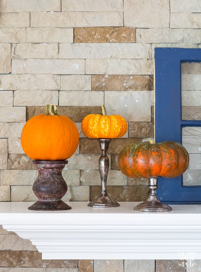 Pumpkins up on pedestals