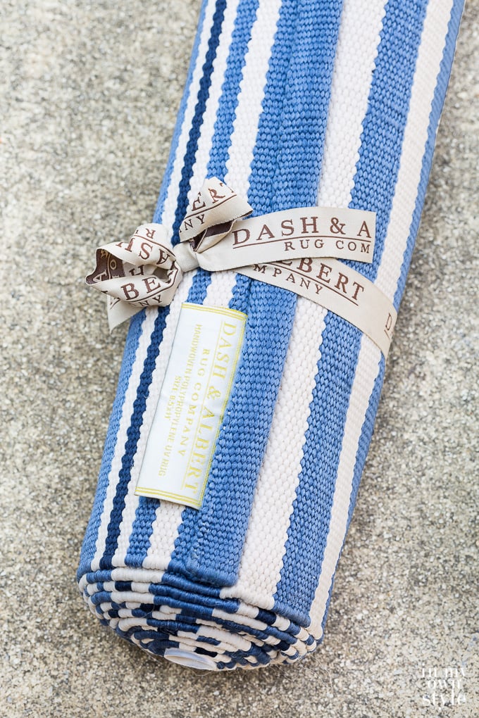 Dash and Albert Rugby Stripe area rug rolled up
