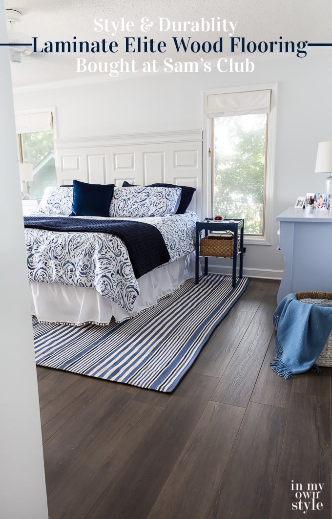 After photo showing how new wood laminate flooring looks in blue and white bedroom
