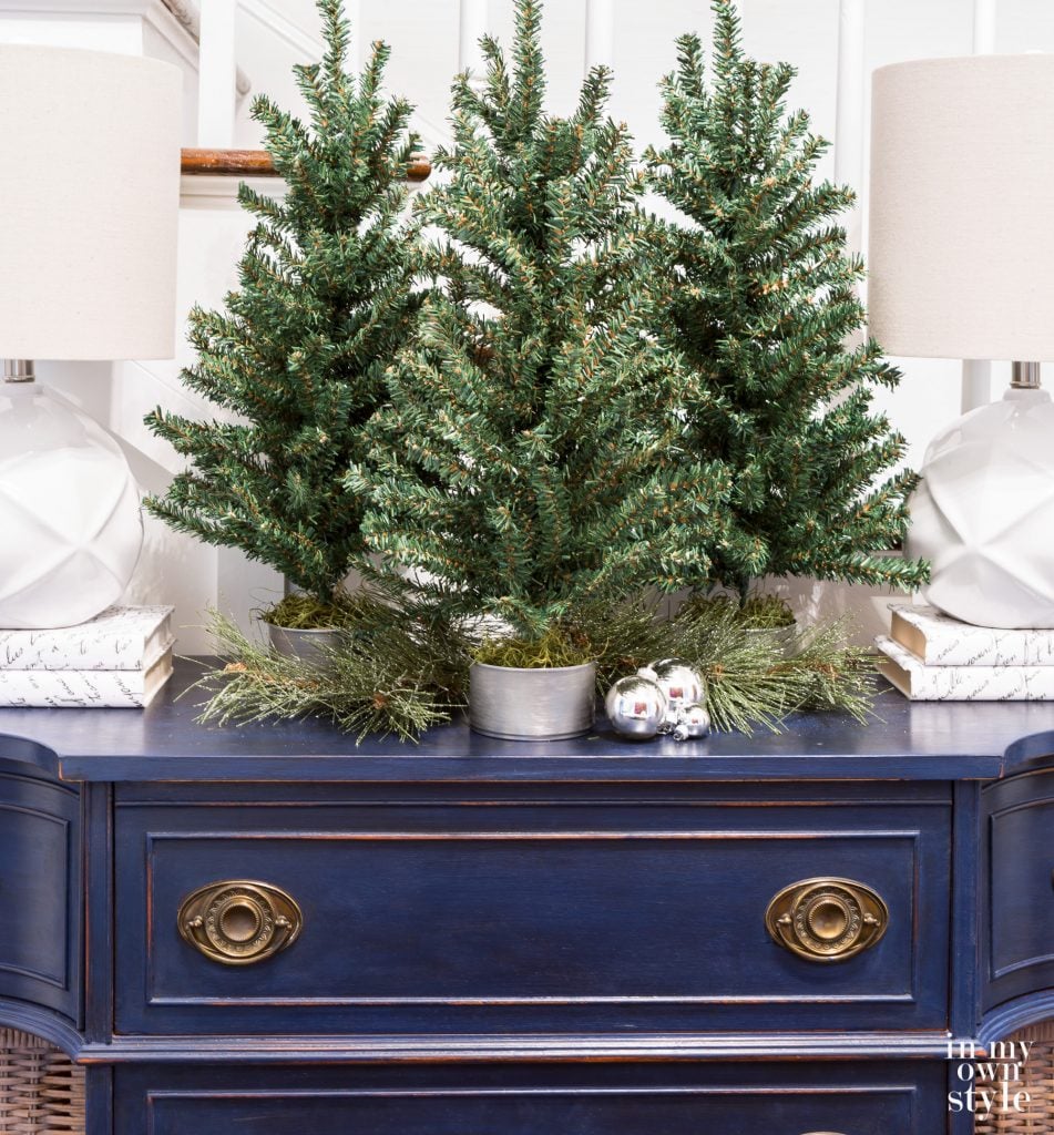 Tabletop Christmas tree decorating idea using tuna cans