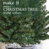 3 mini Christmas trees with black and white stand collars lined up in a row on a table