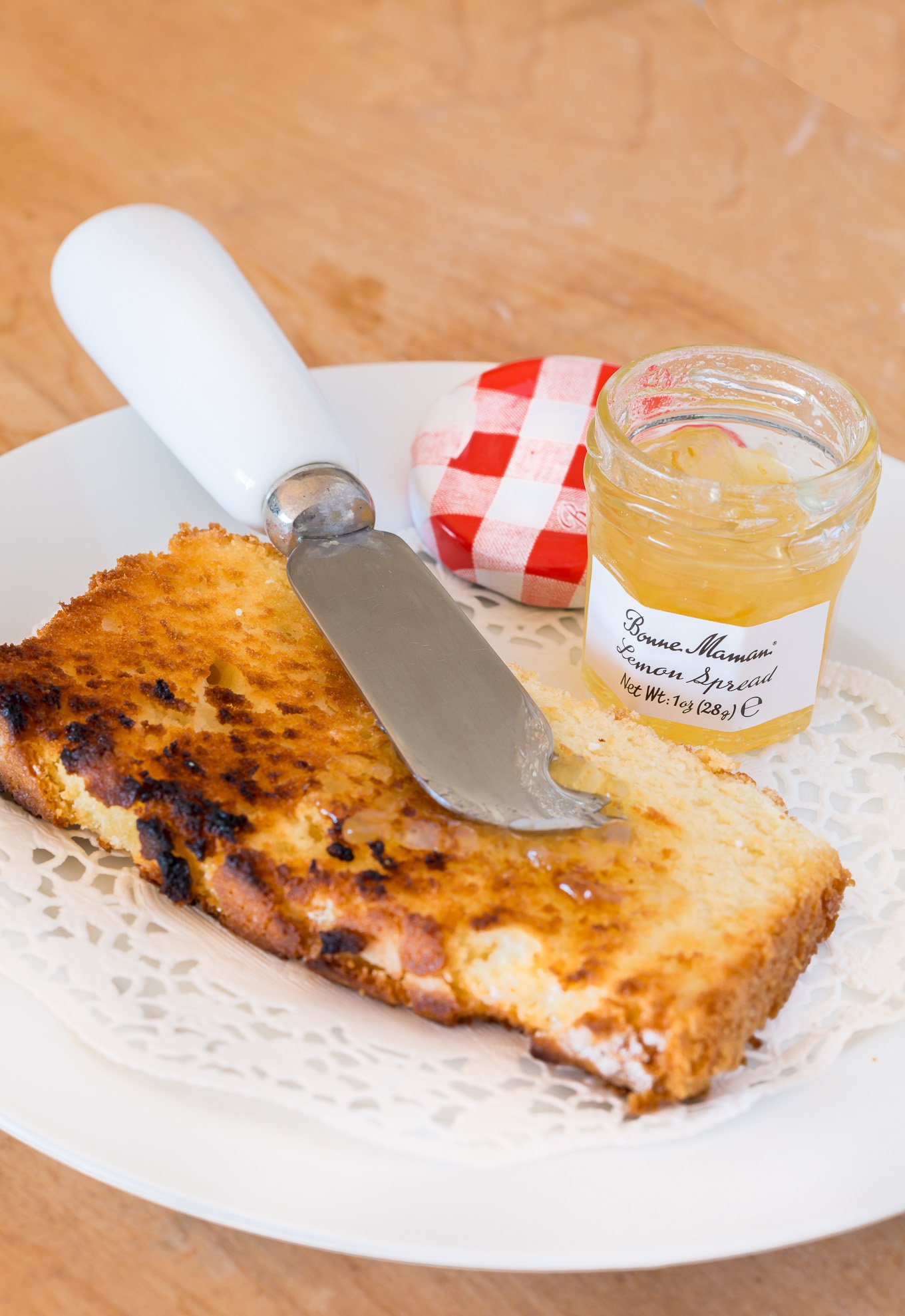 A slice of toasted old fashioned lemon pound cake.