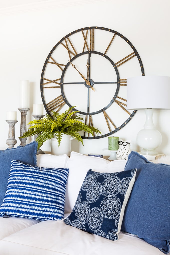 How to arrange long stem fake flowers in a glass vase in living room decor