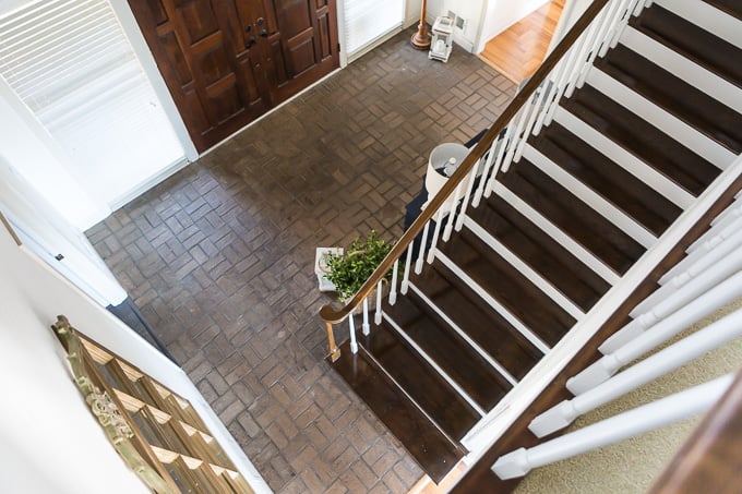 Brown brick floor in foyer of home