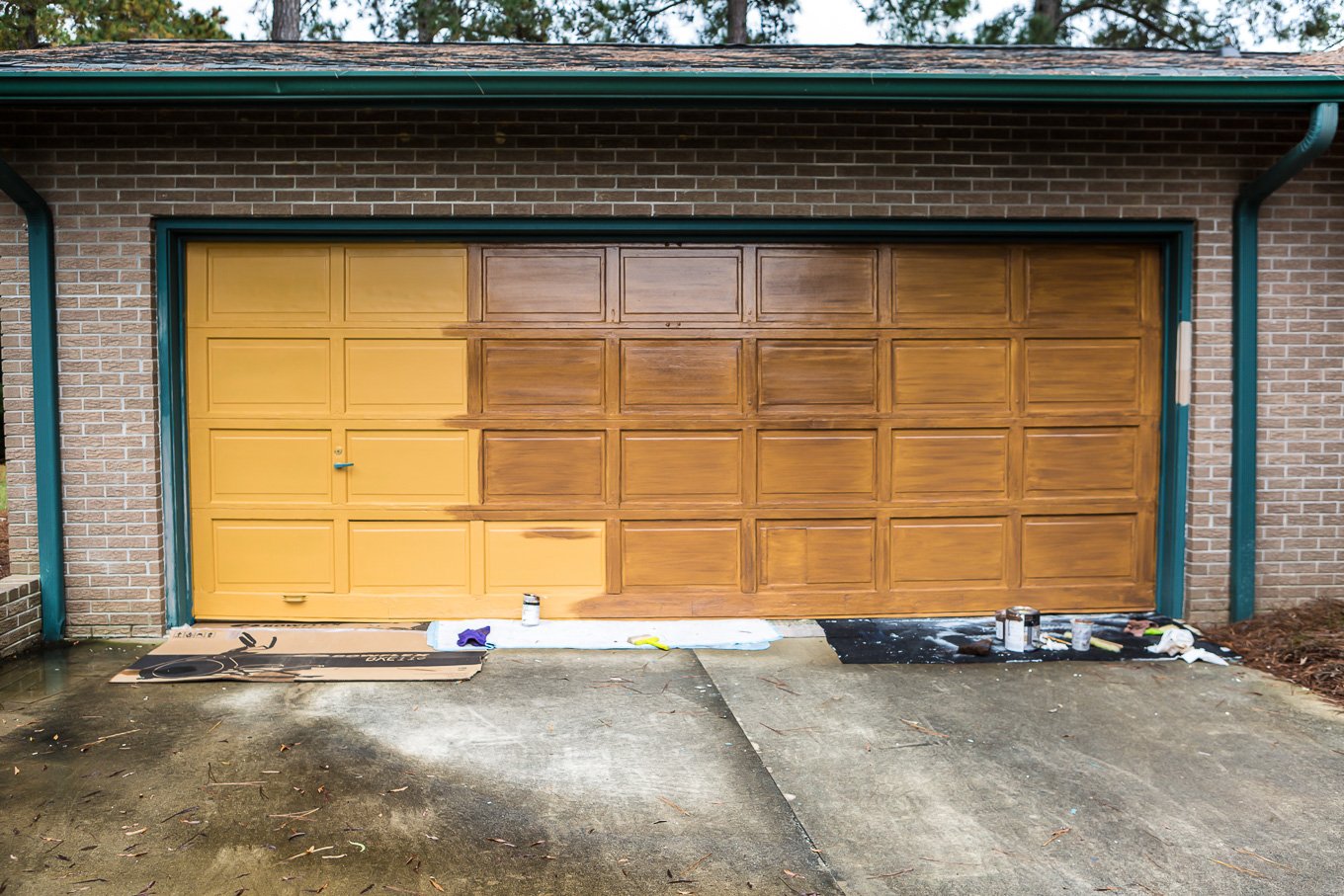 putting second color of paint on garage door being painted to look like it has woodgrain