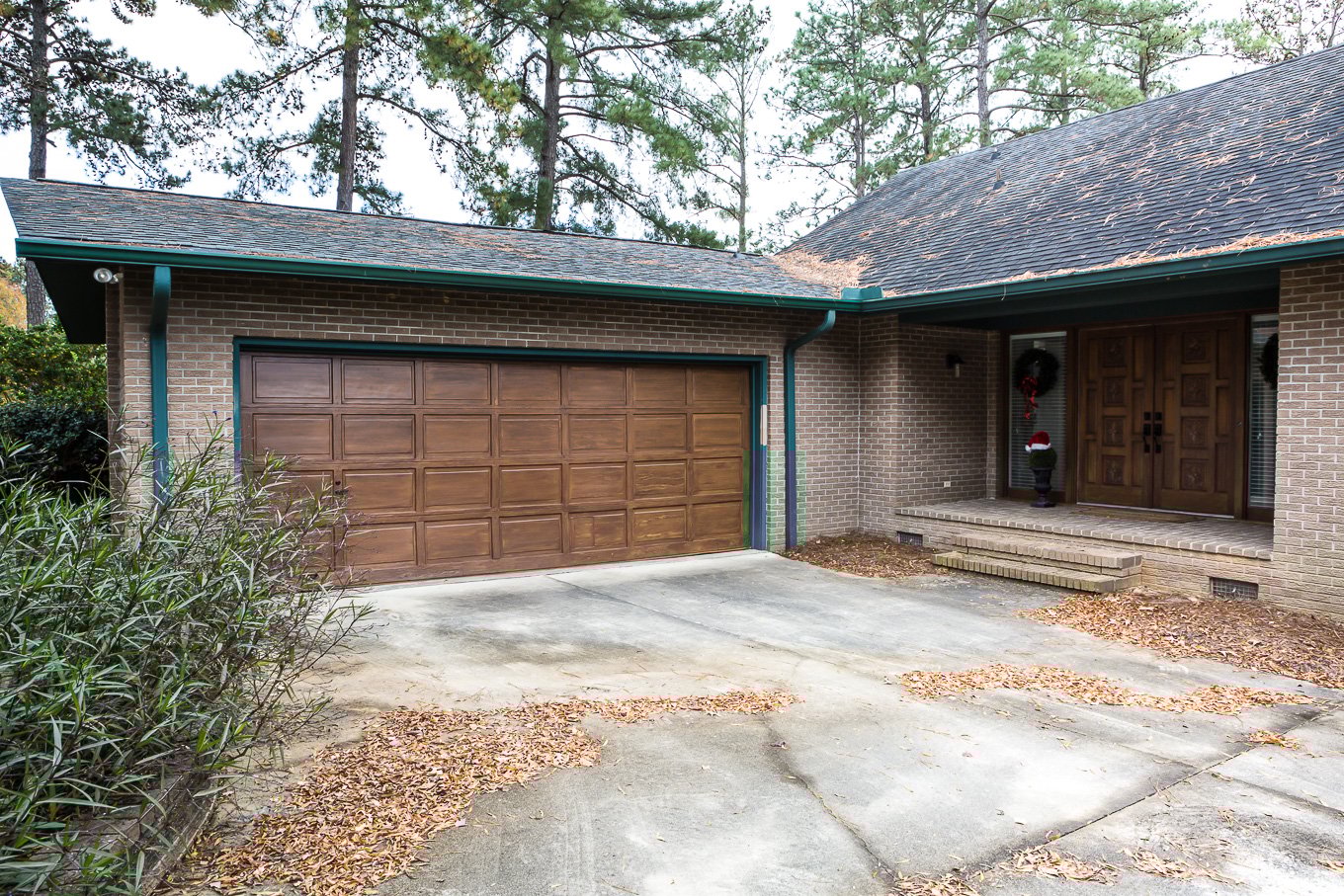Painted garage door painted to look like transparent stained wood