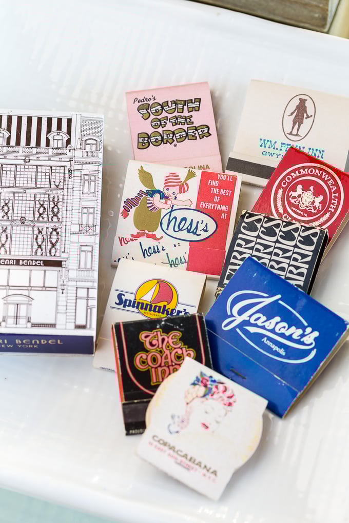 Collection of matchbooks on a pretty plate on a coffee table. Use What You Have Home Decorating Ideas