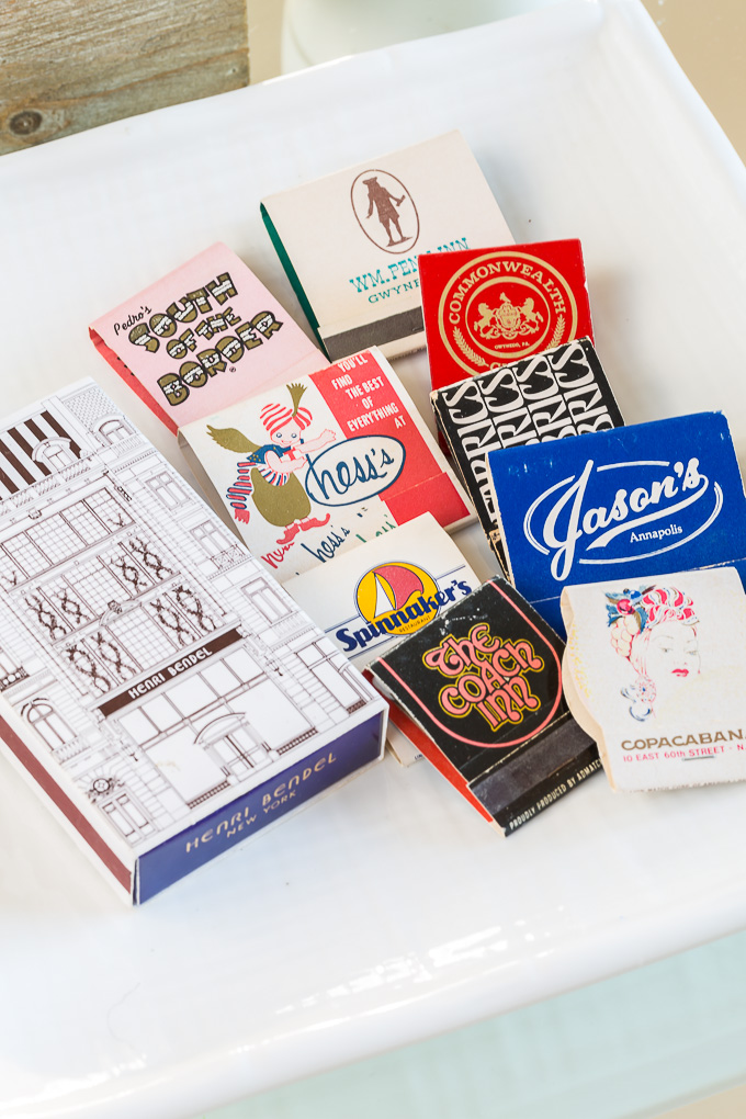 Collection of matchbooks on a pretty plate on a coffee table. Use What You Have Home Decorating Ideas