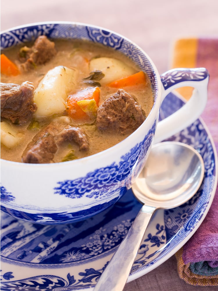 blue and white mug filled with beef stew