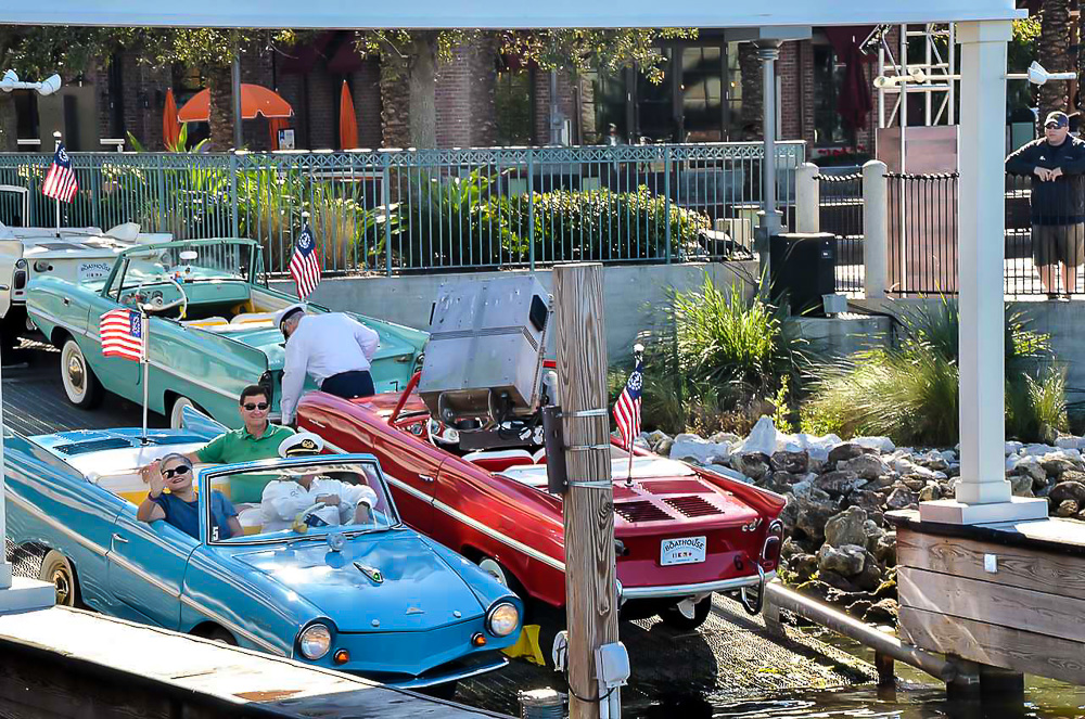 Diane of In My Own Style blog getting a ride in a vintage Amphicar at Disney Springs in Orlando Florida.
