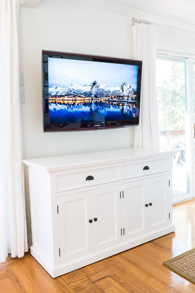 Novo Solo Halifax Buffet with 4 doors under a wall mounted TV