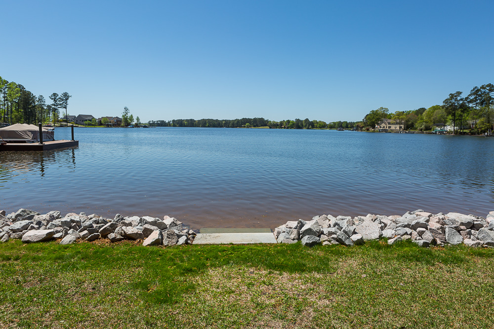 View of lake a riprap along shore of lake viewed from home deck