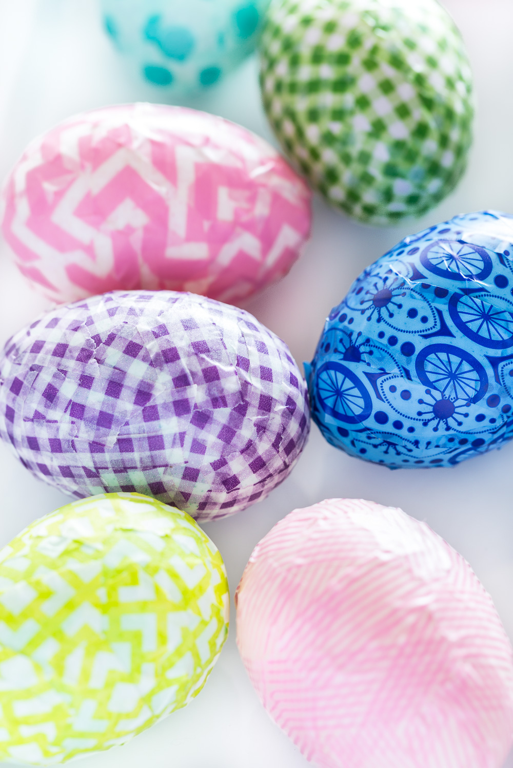 Plastic Easter eggs decorating idea using Washi tape.