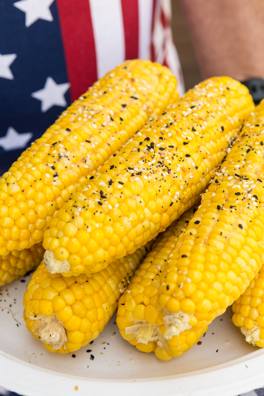 Corn on the cob piled on a Chinet White collection platter