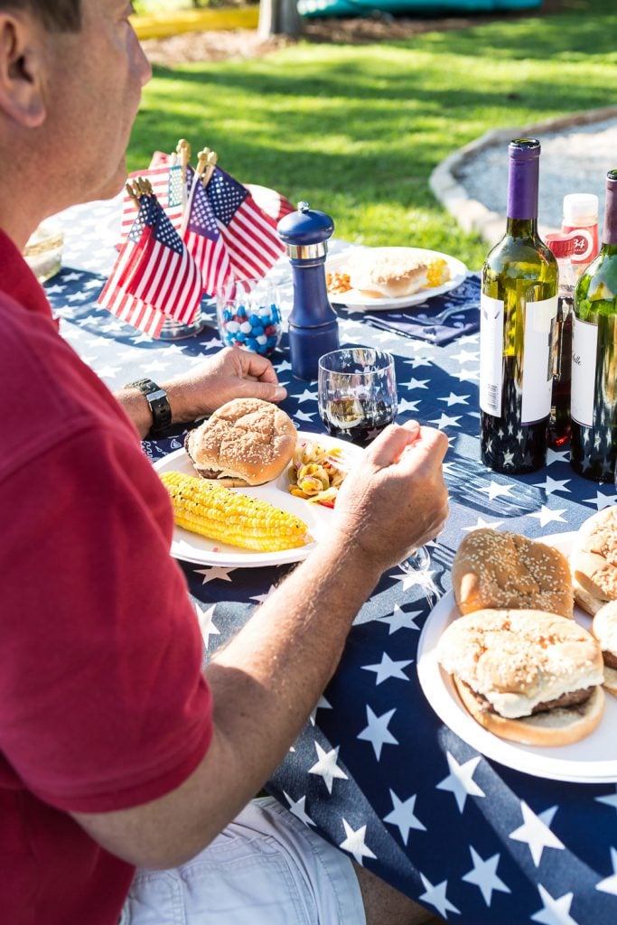 Eating at a patriotic set picnic tablenic