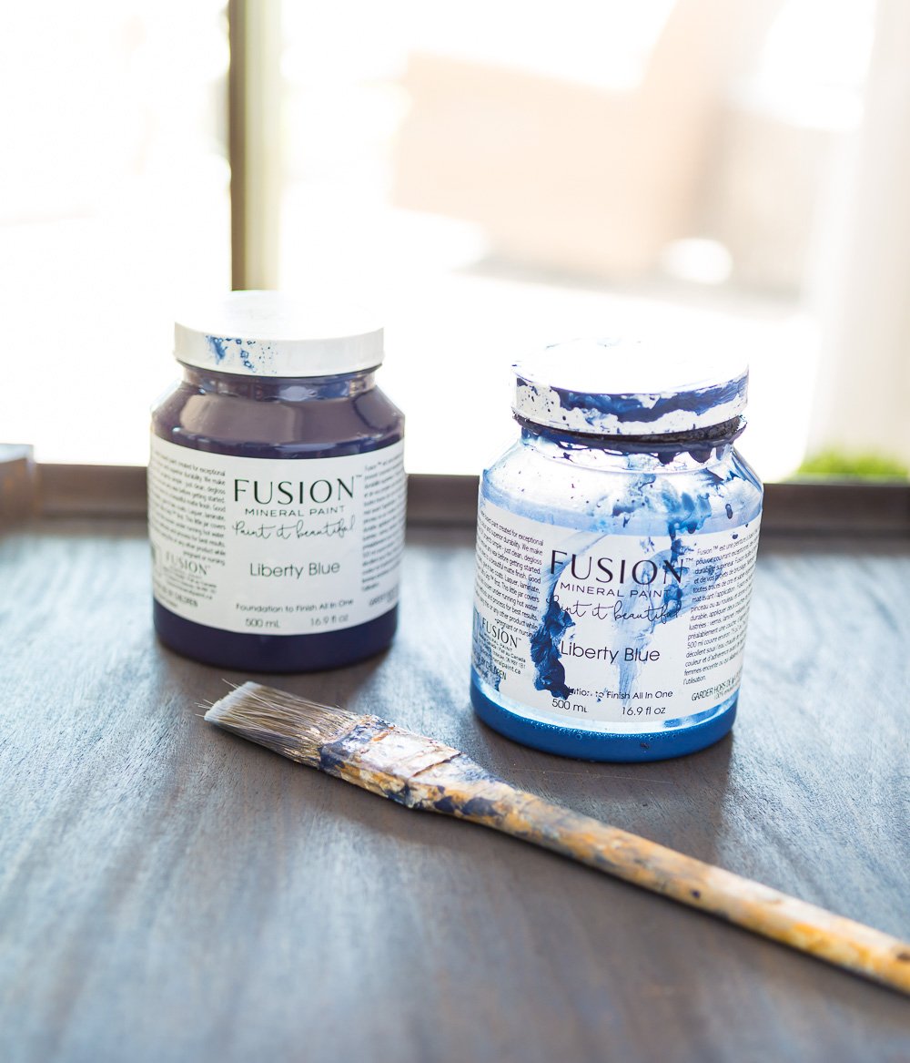 Fusion Mineral Paint in Liberty Blue used to color wash a wood table.