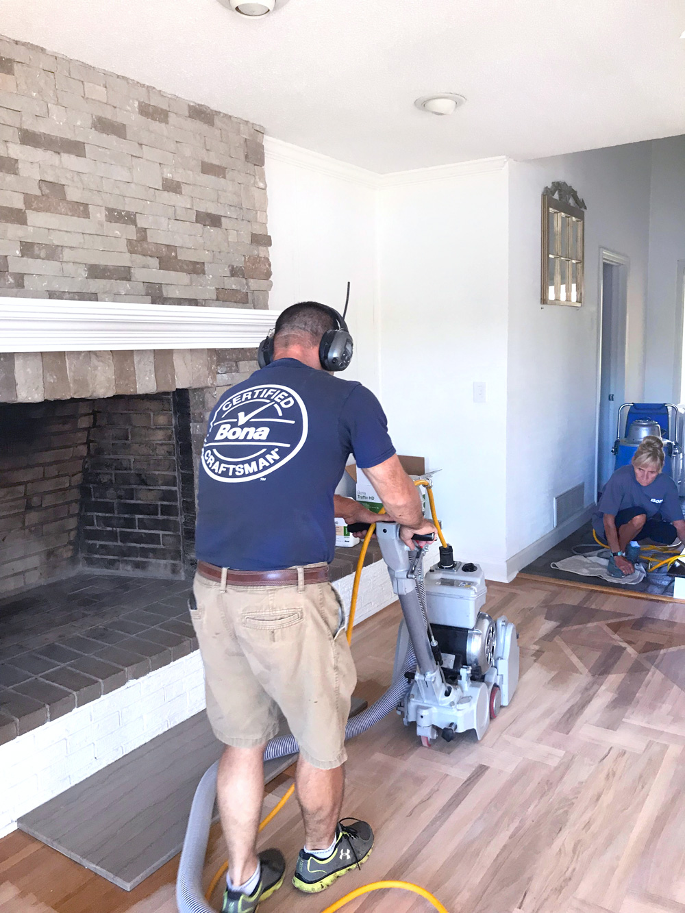 Bona Certified Craftsman sanding a hardwood floor