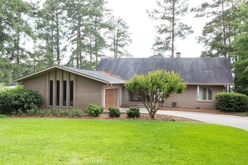 tan brick Ranch house after new paint