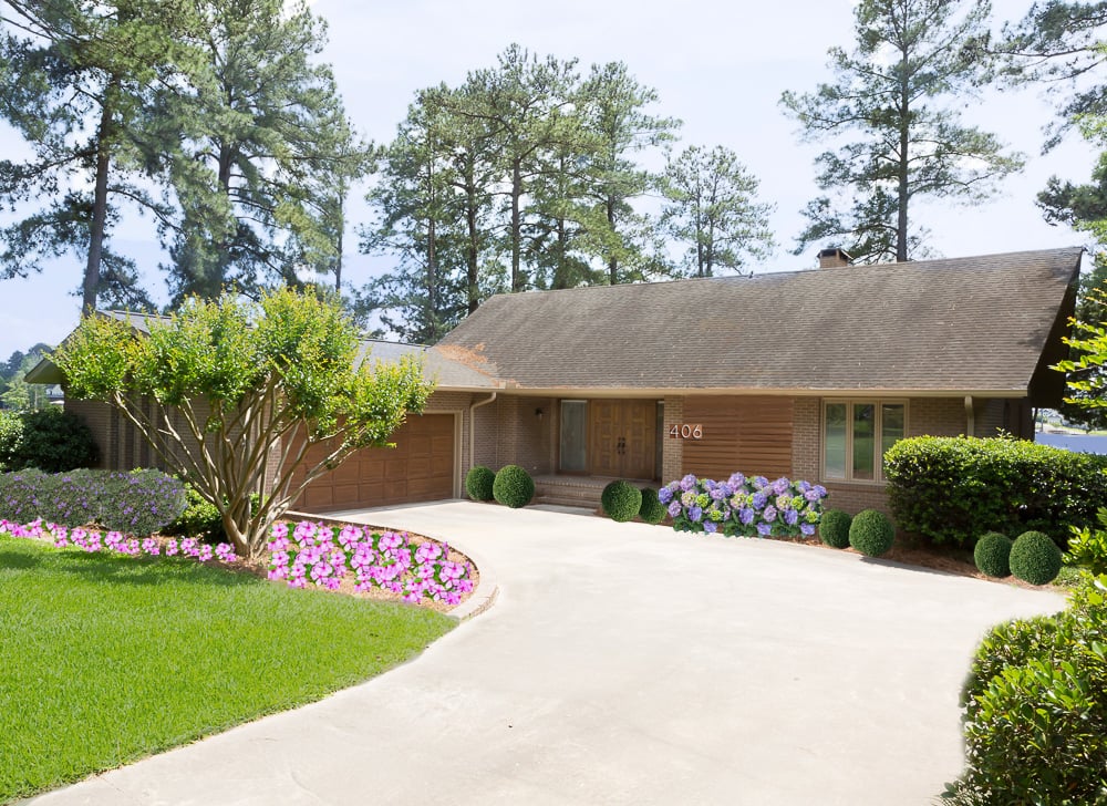 Outside of a home that was just painted tan from a dark teal color