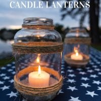 Image of picnic table with a patriotic tablecloth and DIY oversized glass candle lantern to make
