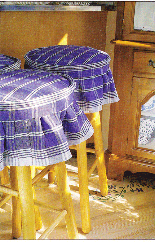 Blue and white skirted fabric stool top covers.