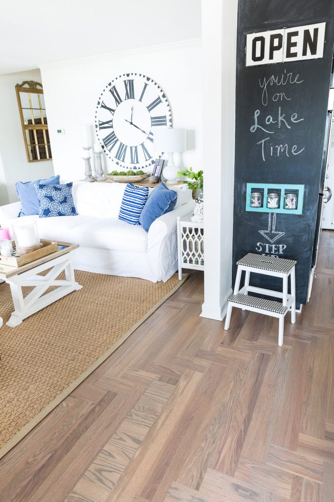 Open concept floor plan decorating tips. Shown in the photo is how and area rug separates two rooms.