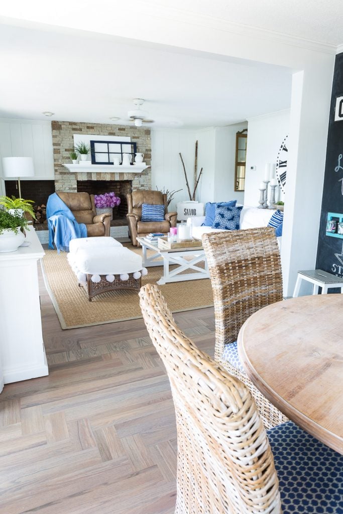 Open concept floor plan in home with coastal blue and white decorating.
