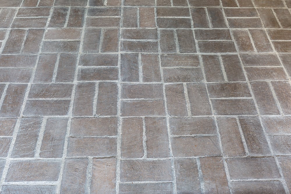  A section of floor showing the completed whitewashing over the brick and grout floor.