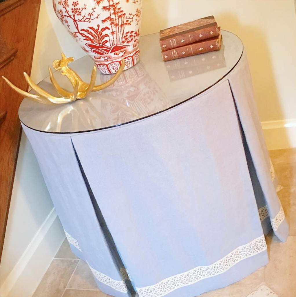 A pleated drum style skirted table.