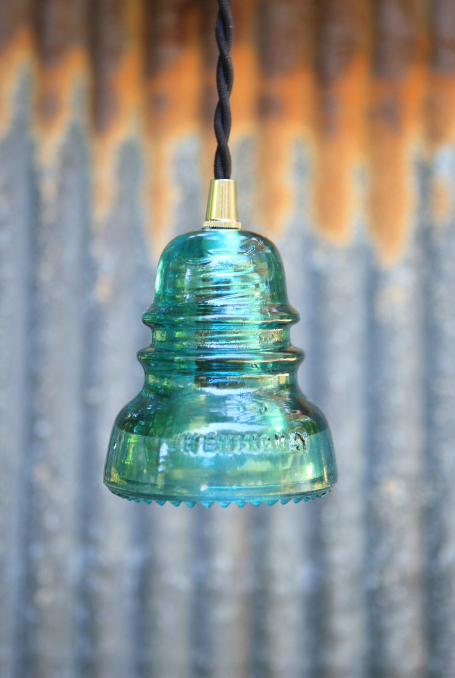 aqua glass insulator made into a pendant light.