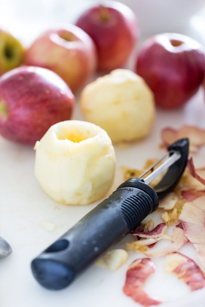Apples being peeled and cored to make apples wrapped in piecrust