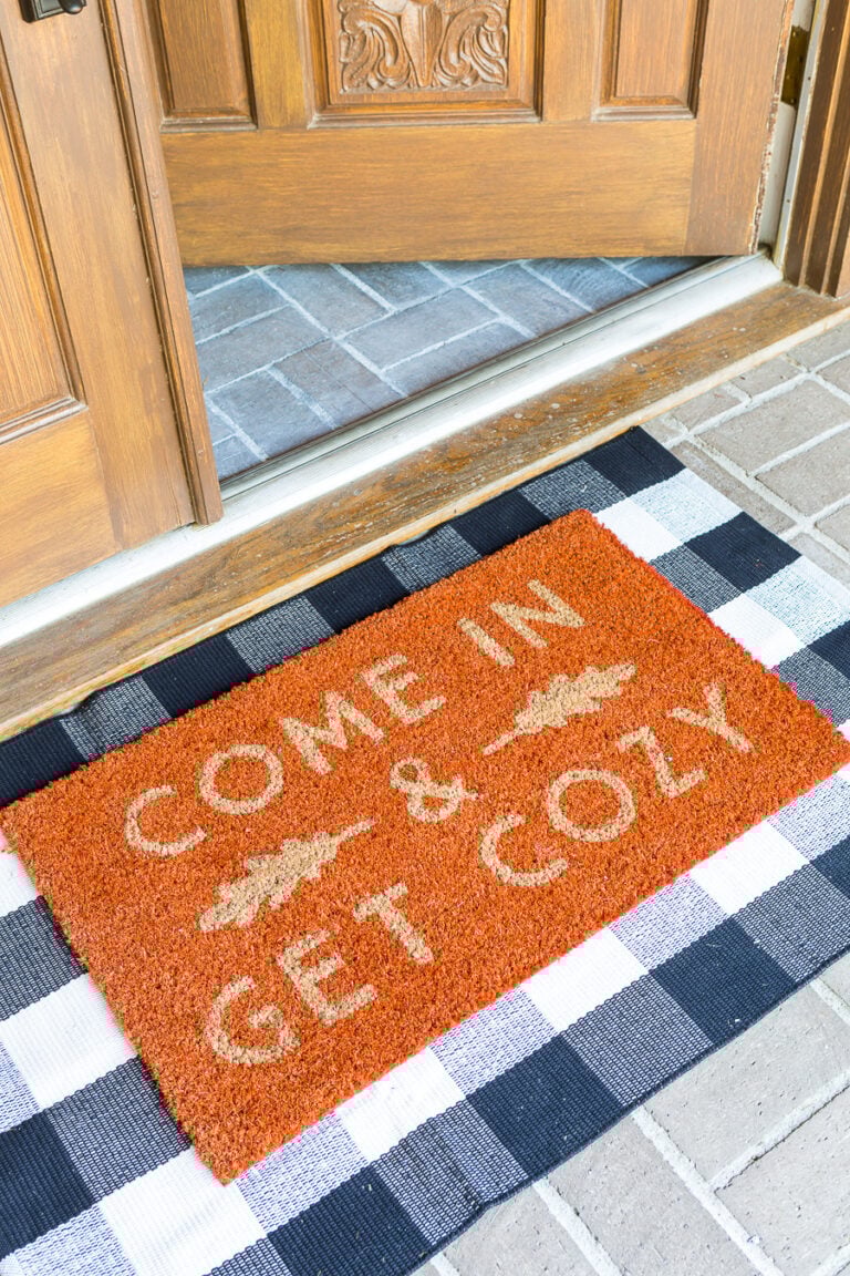 Come In and Get cozy fall doormat on front porch of home