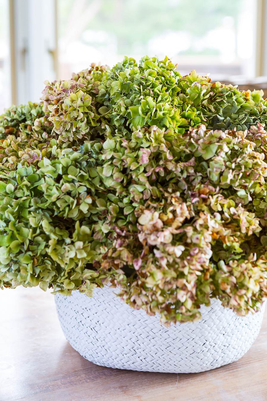 basket vase filled with dried hydrangeas for fall decor