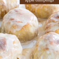 Image of a plate filled with delicious baked apples wrapped in pie crusts called Cannon Ball apple dumplings.