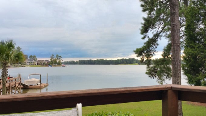 Lake house view of water on stormy day.