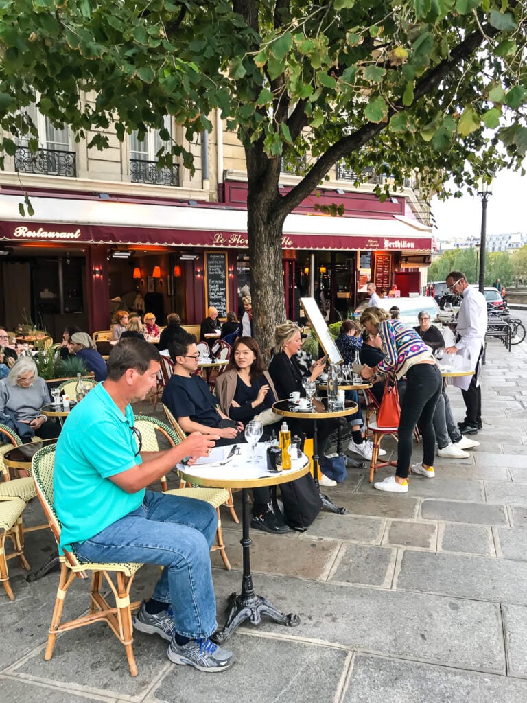 Eating dinner at a cafe along the Seine in Paris