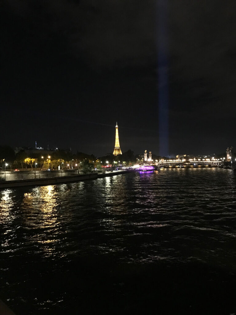 The Eiffel Tower at night viewed from the Right Bank of the Seine while on a Paris bike tour at night.