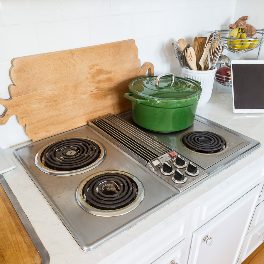 Vintage 1970 Jenn Air cooktop in white kitchen.