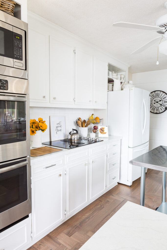 picture of a white kitchen with painted kitchen countertops.