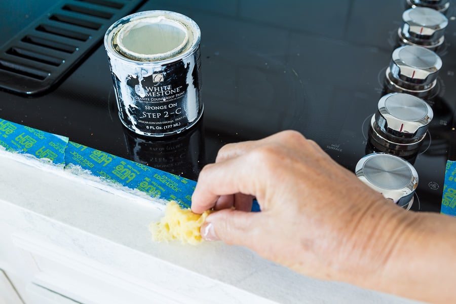 How to fix a painted kitchen countertop. Use a sea-sponge to blend the paint.