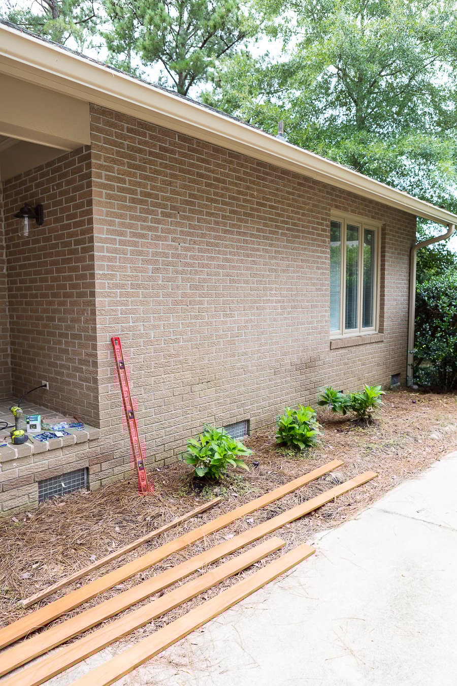 How to prep a brick wall to build an exterior horizontal wood accent wall