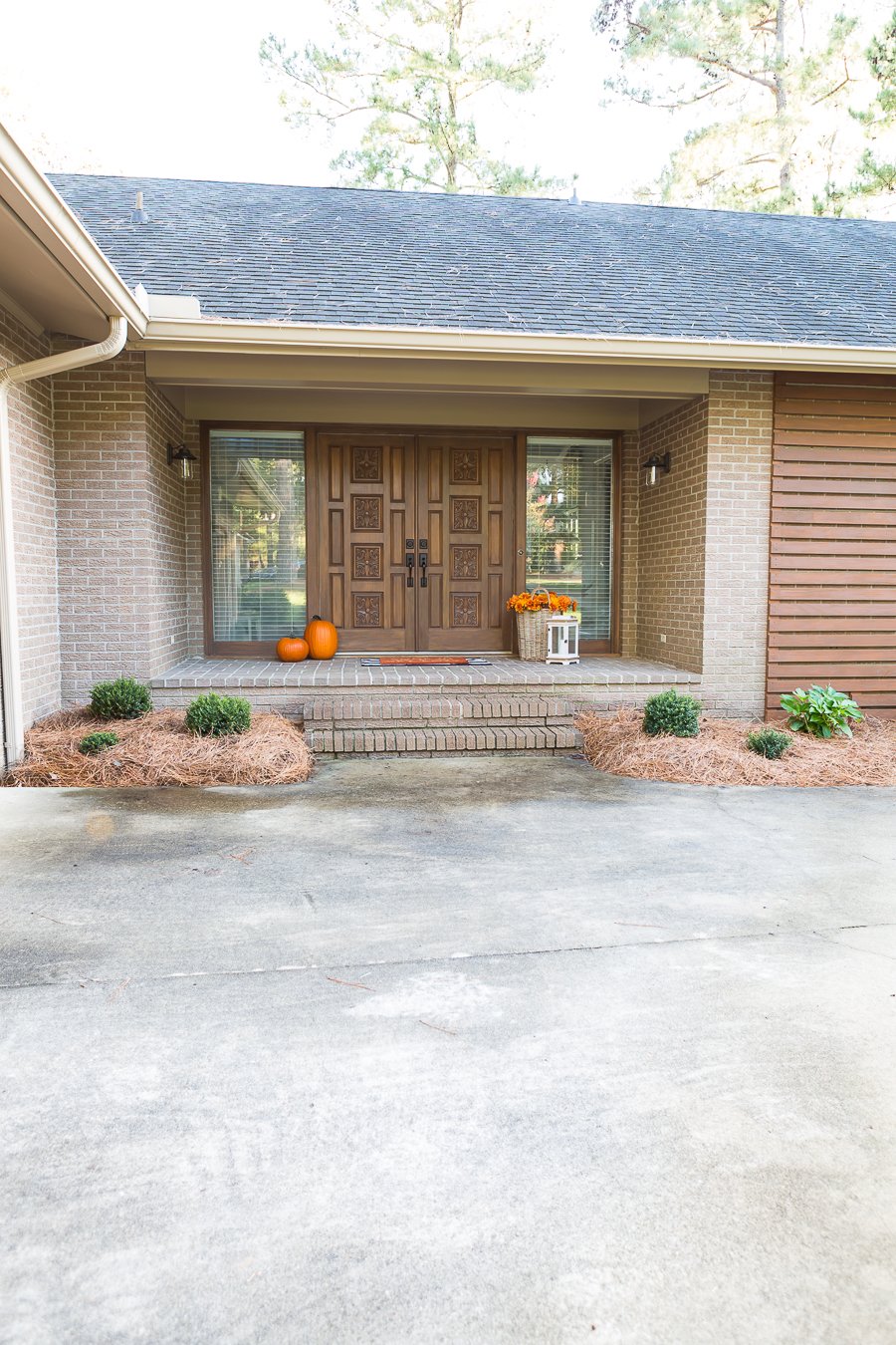 front entry of a 1970's ranch home that is getting a budget modern makeover