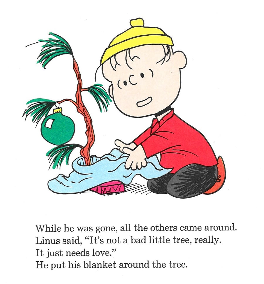 Linus from Charlie Brown's Christmas putting his blanket around the forlorn little tree in a stand. 