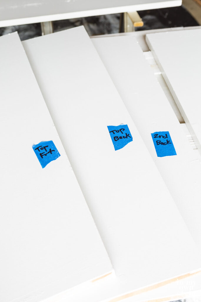Blue painters tape made into labels to number shelves if removing them from closet before painting.